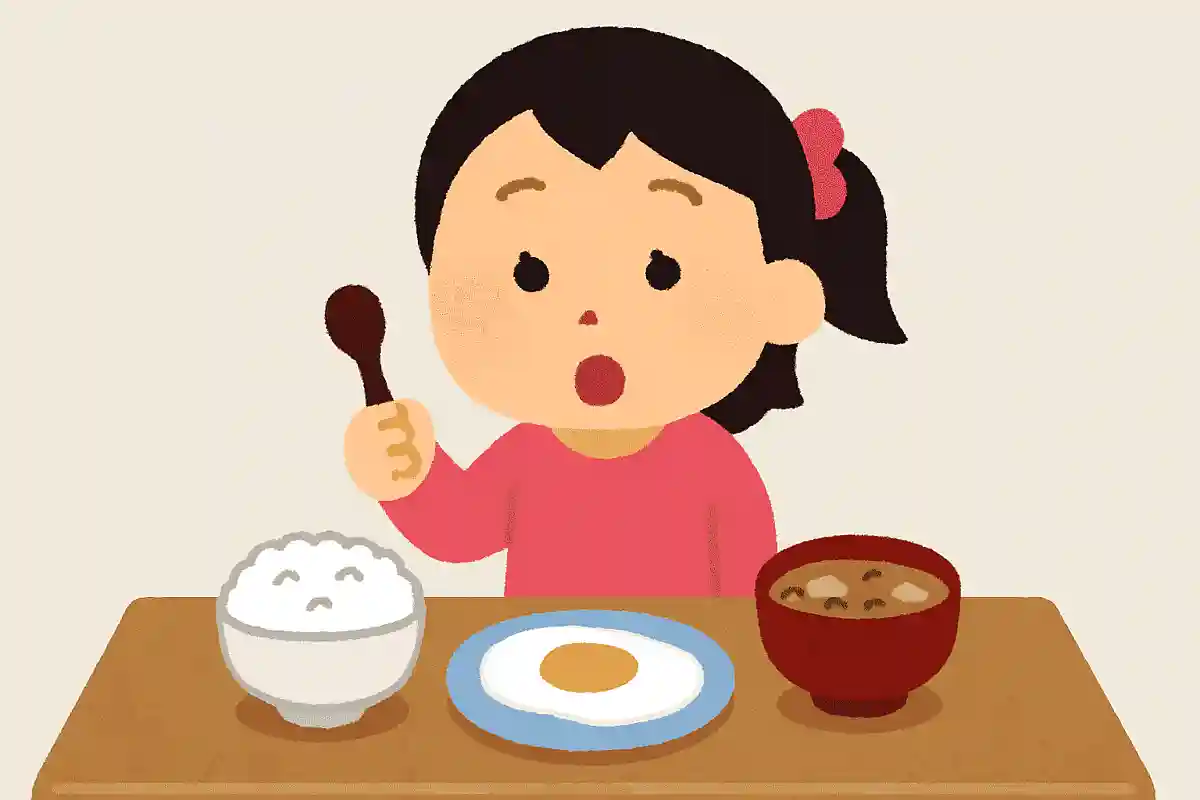 ごはんをたべようとしたはなこちゃん。ごはんとめだまやき、みそしるがならんでいます。さいしょにえらんだのはなんでしょう？