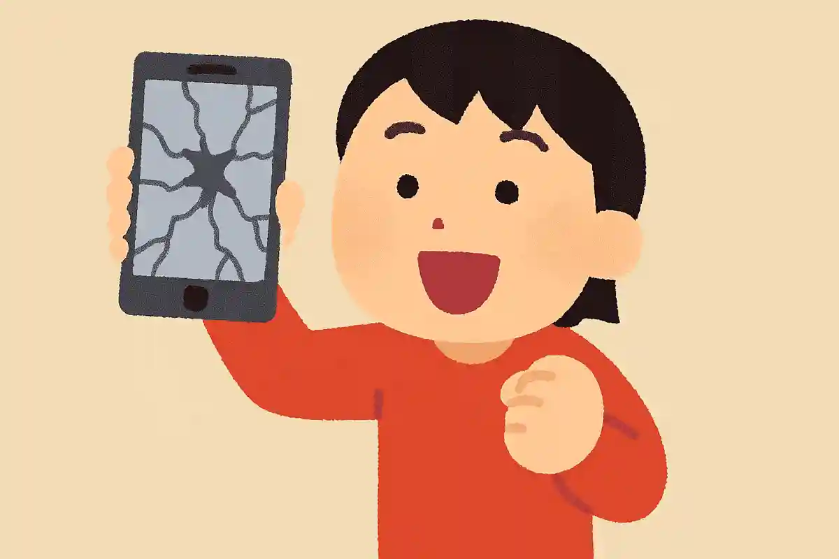 画面が割れたスマホを持っている人